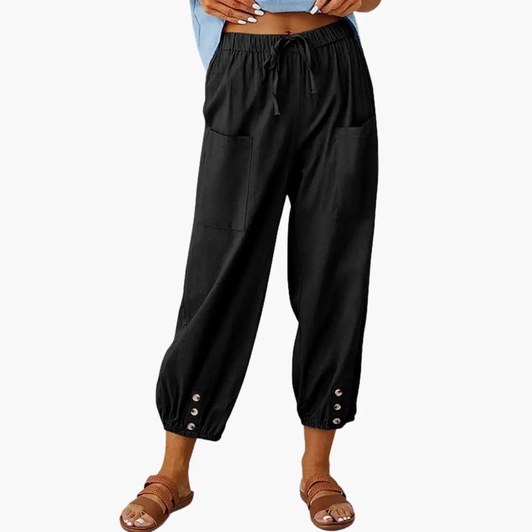 Women's casual pants by Wilfred Smith with drawstring waist and side pockets in black.