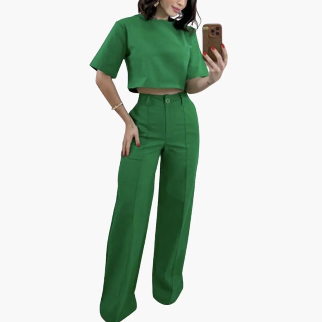 Women's two-piece set: green crop top and high-waisted wide-leg trousers.