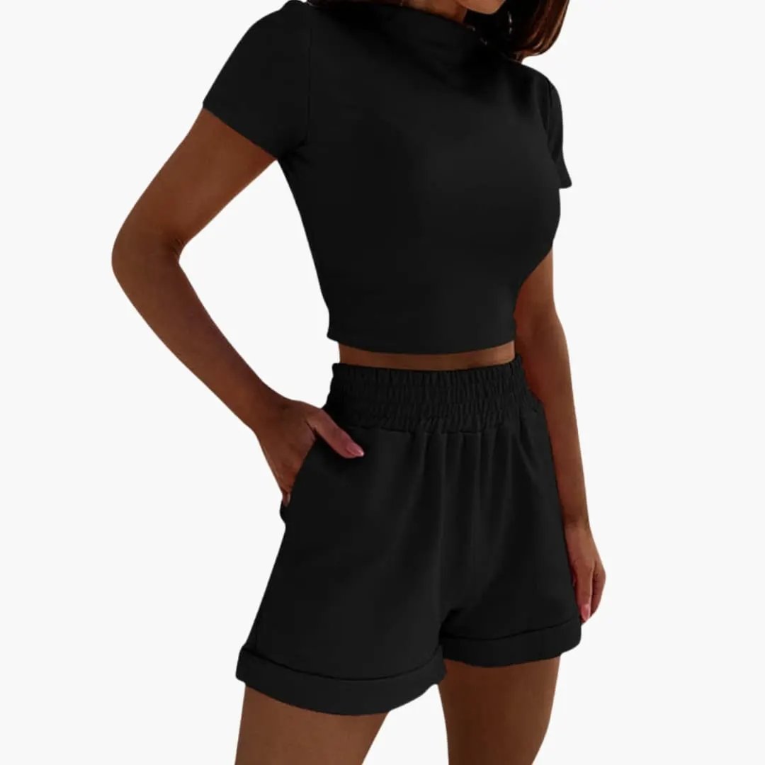 Women's two-piece set: black crop top and elastic-waist shorts.