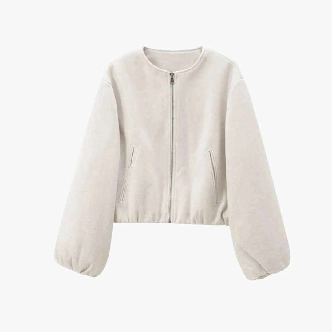 Women's cropped bomber jacket in beige with zip front, elastic waist, long puff sleeves.