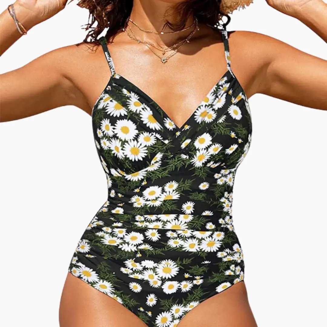 Women’s cross-front backless one-piece swimsuit in black with white daisy print
