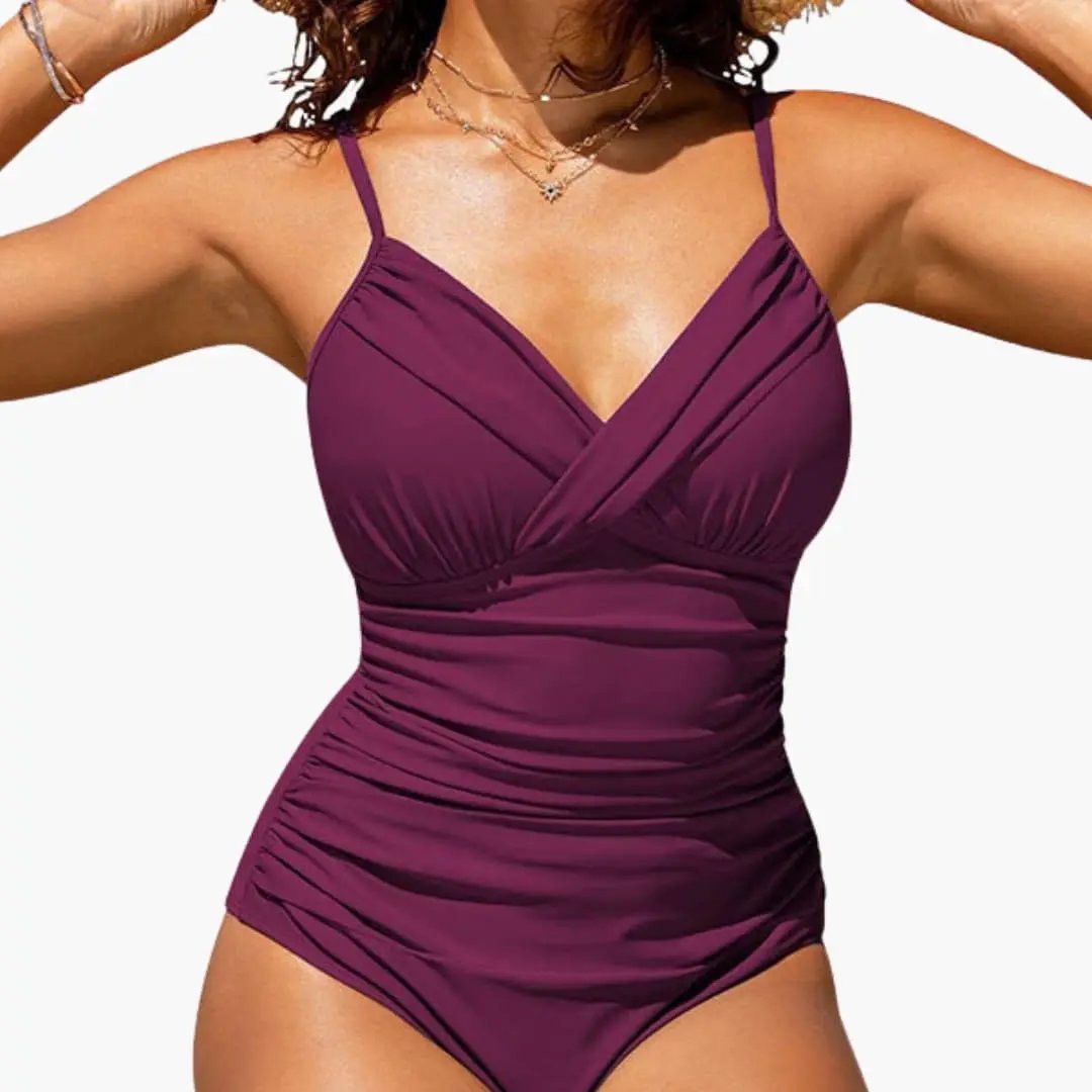 Women’s Cross Front Backless One-Piece Swimsuit in burgundy with ruching.