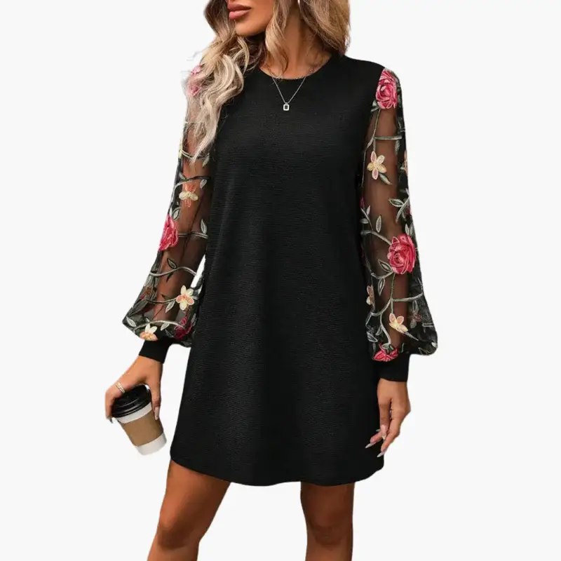 Women's black dress with embroidered sheer floral sleeves and relaxed fit by Wilfred Smith.