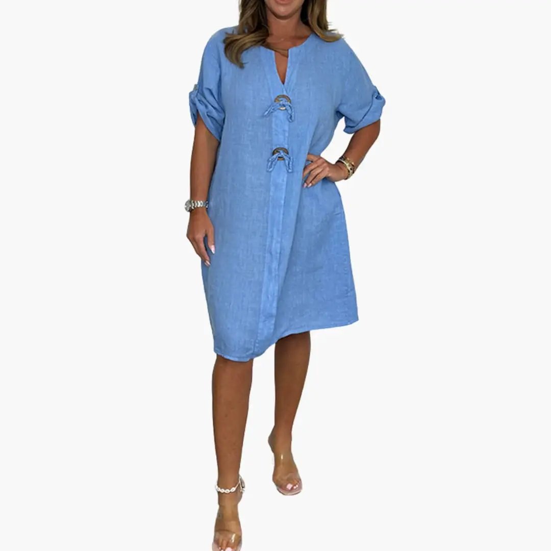 Women's blue dress with long sleeves and front toggle closures