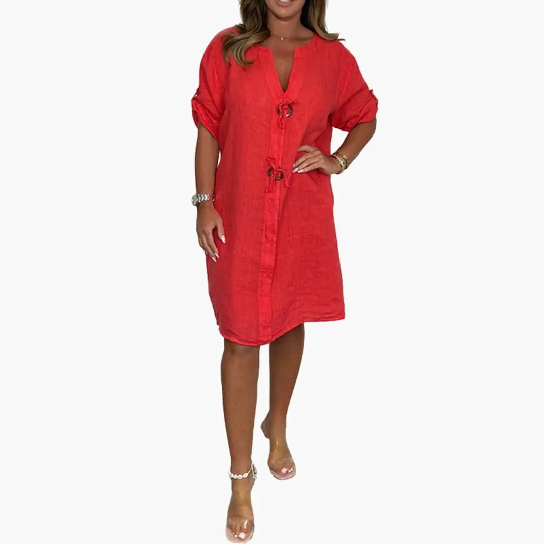 Women's dress by Wilfred Smith in red linen-like fabric, knee-length with long sleeves and front tie closures