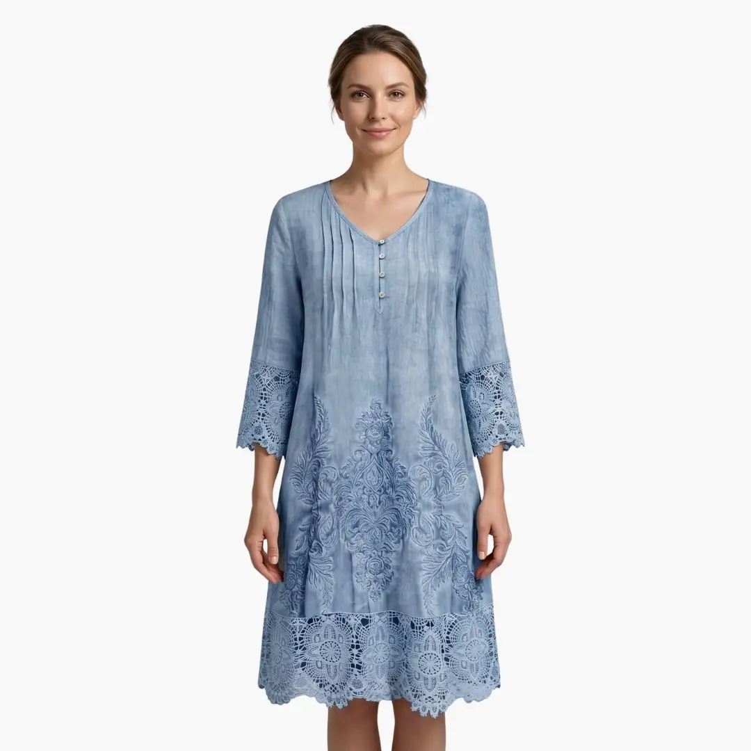 Wilfred Smith women's embroidered midi dress in light blue with floral embroidery and lace hem.