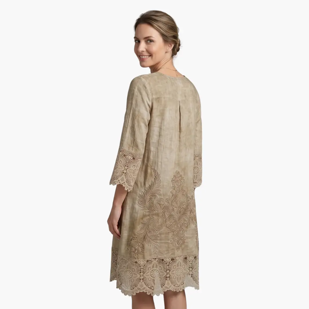 Wilfred Smith Women’s Embroidered Midi Dress in beige with lace trim on sleeves and hem, defined waist.