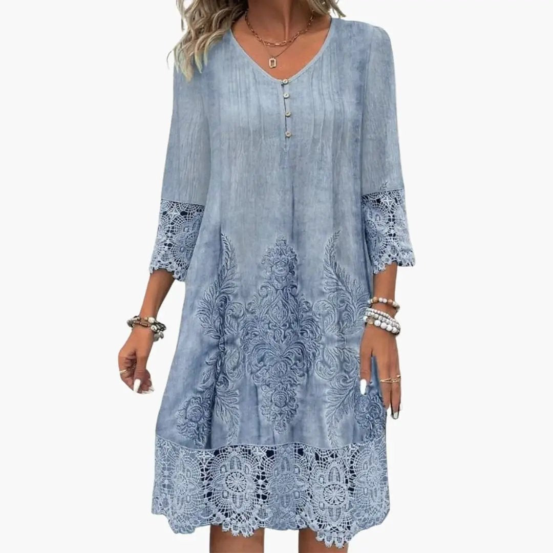 Women’s embroidered midi dress in light denim blue with lace hem and lace-trimmed short sleeves by Wilfred Smith