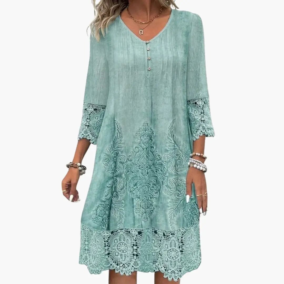 Women’s Embroidered Midi Dress by Wilfred Smith, seafoam teal with lace hem and cuffs.