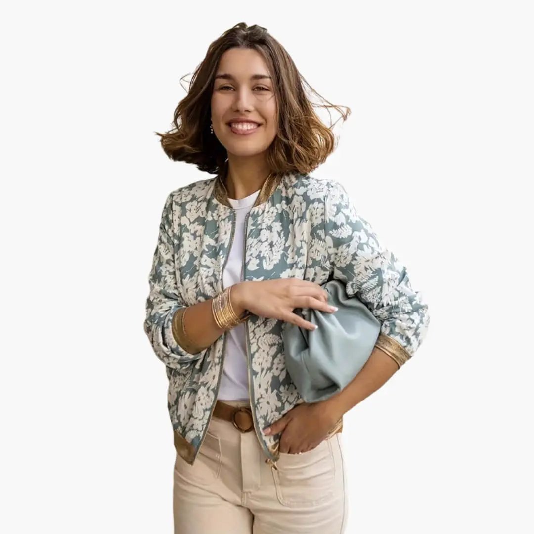 Women's bomber jacket by Wilfred Smith featuring teal floral print and zip closure.