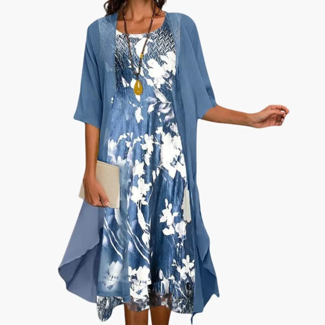 Women's floral long dress with cardigan set by Wilfred Smith, blue with white floral print and matching cardigan.