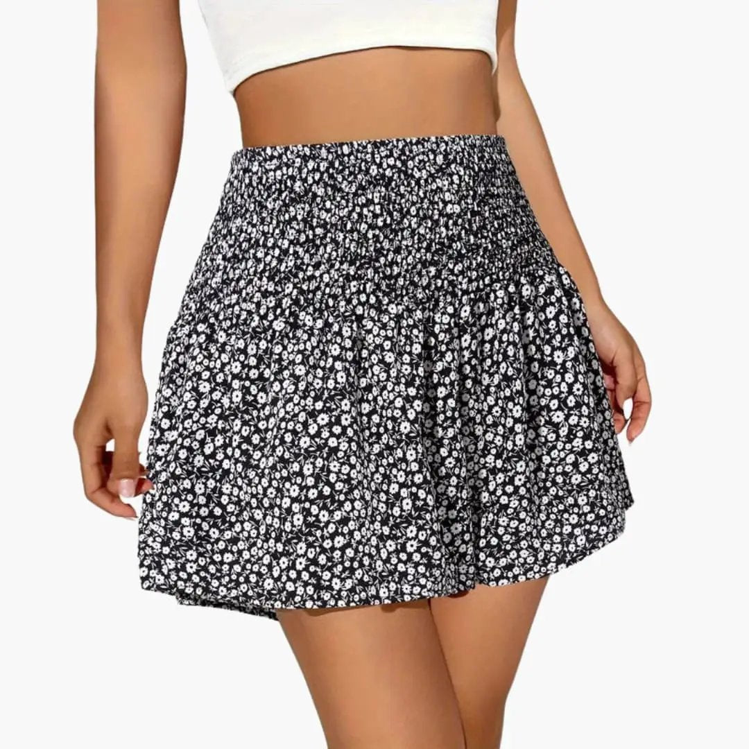 Women’s floral print elastic waist shorts by Wilfred Smith, black with small white flowers