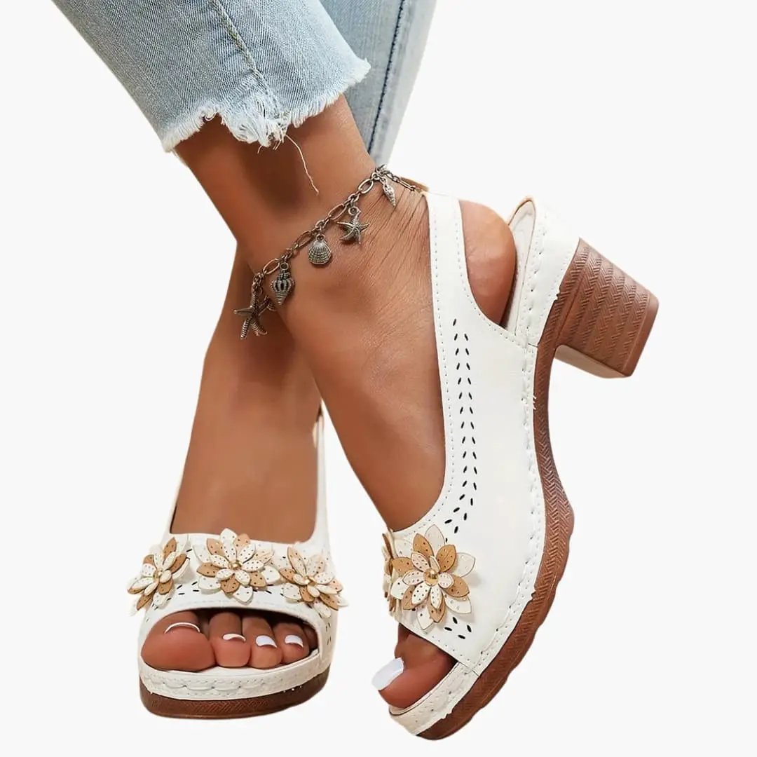 Wilfred Smith women's heeled sandals with ankle strap and floral appliqué; white sandals with wooden block heel