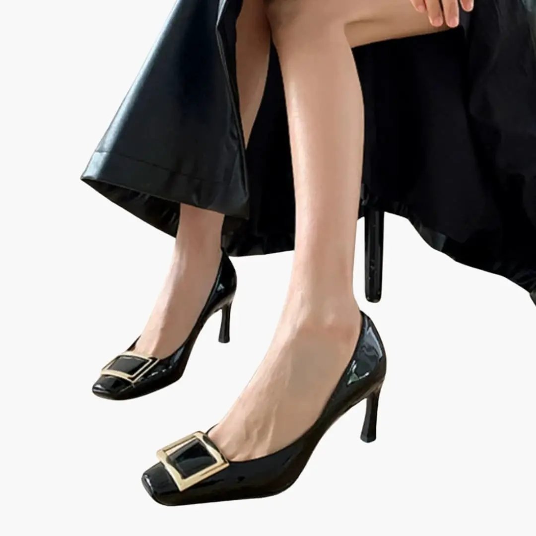 Women's heeled sandals by Wilfred Smith in black patent with gold square buckle and square toe.