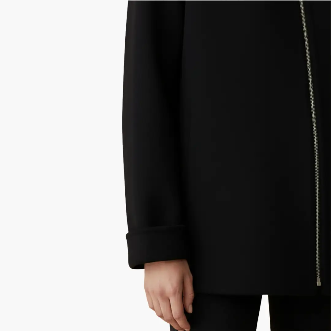 Women's black hooded jacket with front zipper and rolled cuffs.