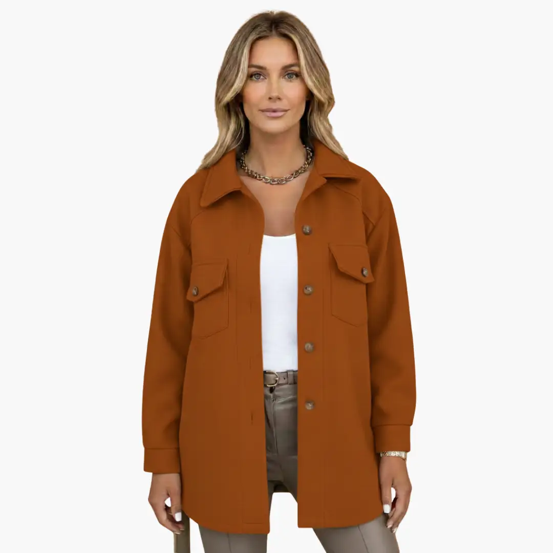 Women’s long rust-orange jacket with button front and two chest pockets.