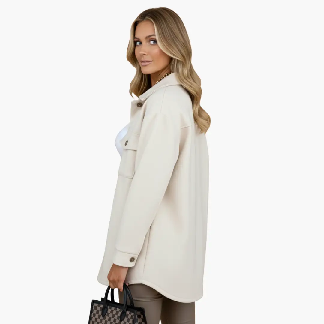 Women’s cream long jacket with front buttons and chest pockets by Wilfred Smith