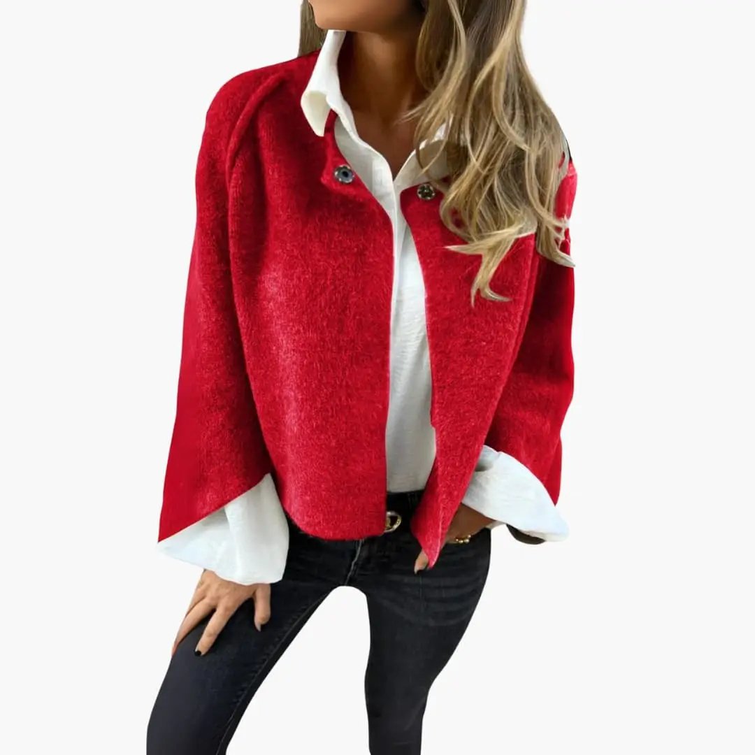 Women’s cropped red bolero jacket with round neckline worn over a white blouse