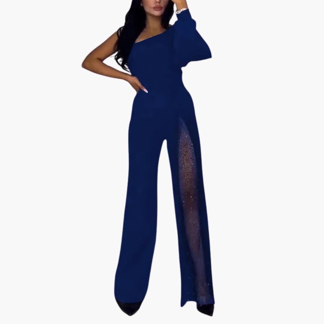 Women’s one-piece jumpsuit in navy blue with sheer sequin side panel, asymmetric neckline, and wide-leg silhouette.