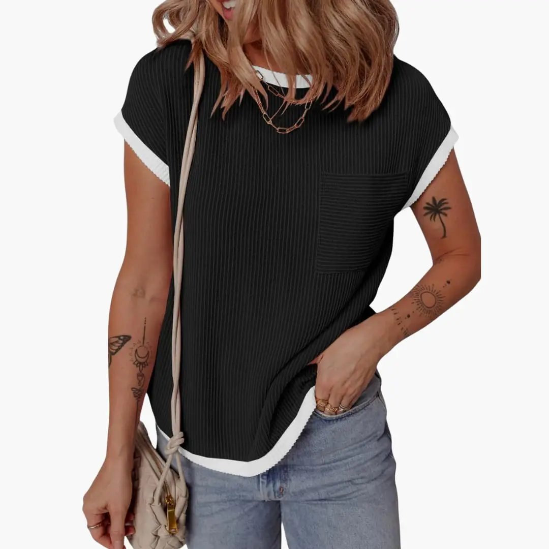 Women's knit crew-neck short-sleeve T-shirt in black with white trim, contrast panel, ribbed fabric and chest pocket.