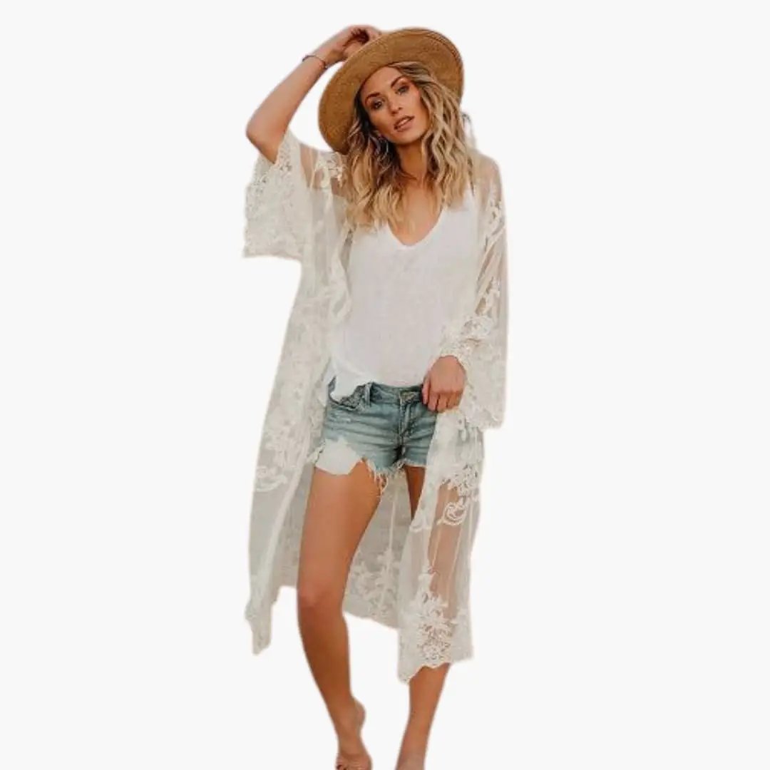 Women's white lace top with open front and short sleeves, model wearing denim shorts and a straw hat.