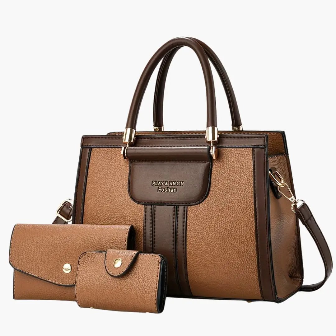 Women's leather shoulder bag by Wilfred Smith with magnetic flap and adjustable strap; includes tan wallet and card case (3-piece set).