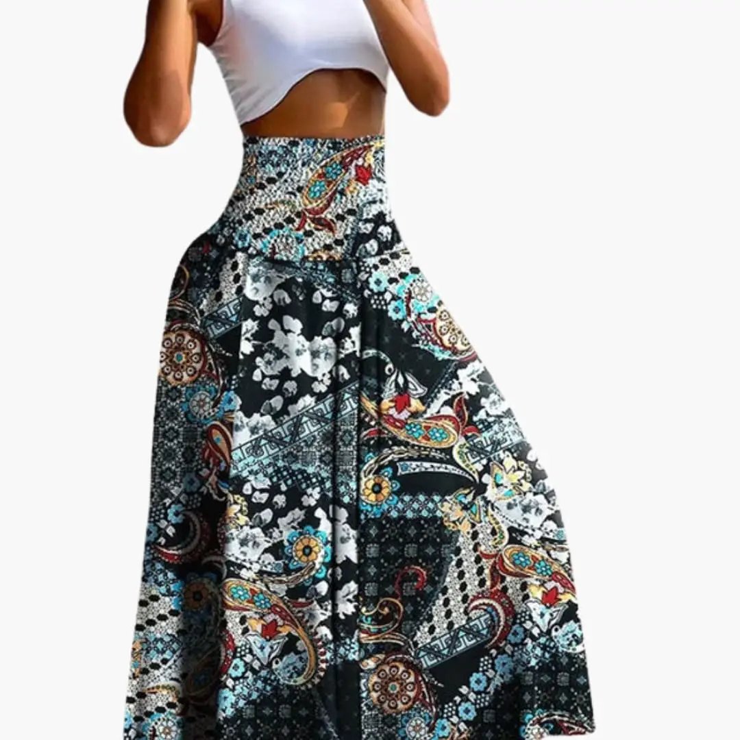 Women's long A-line skirt by Wilfred Smith with elastic waistband and side pockets, colorful paisley print.