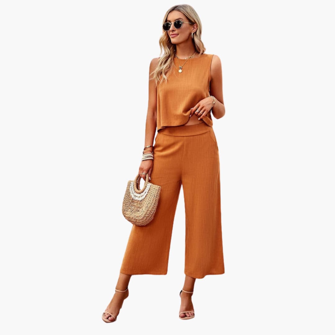 Women's Long Sleeve Button Front Jumpsuit by Wilfred Smith, rust orange, wide-leg one-piece.