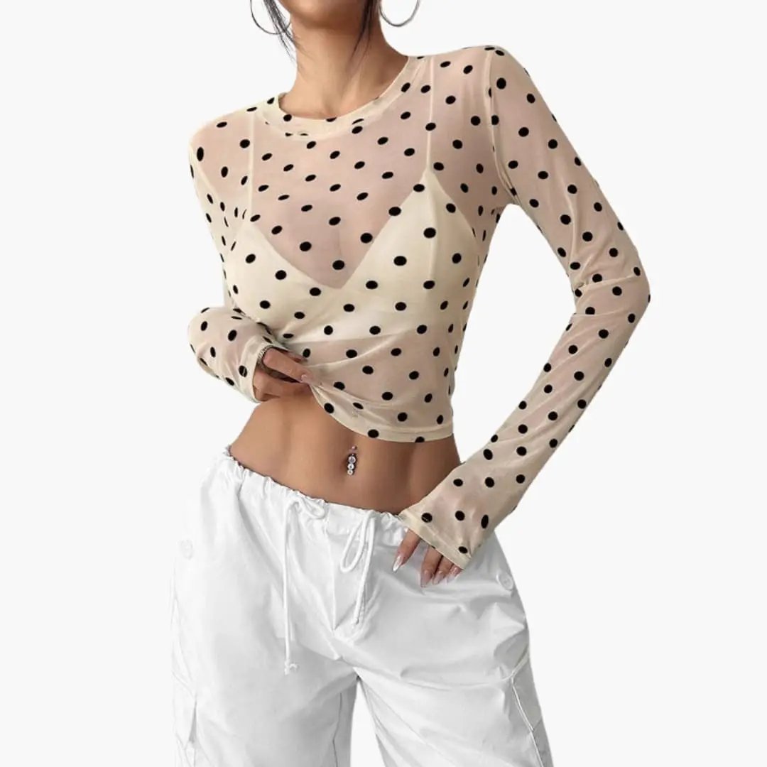 Women's blouse: beige sheer long-sleeve polka dot top with round neckline.