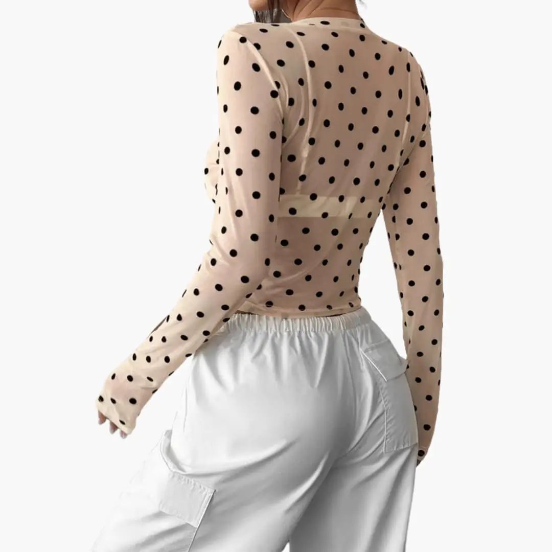 Women's long sleeve polka dot blouse in beige with round neck, back view