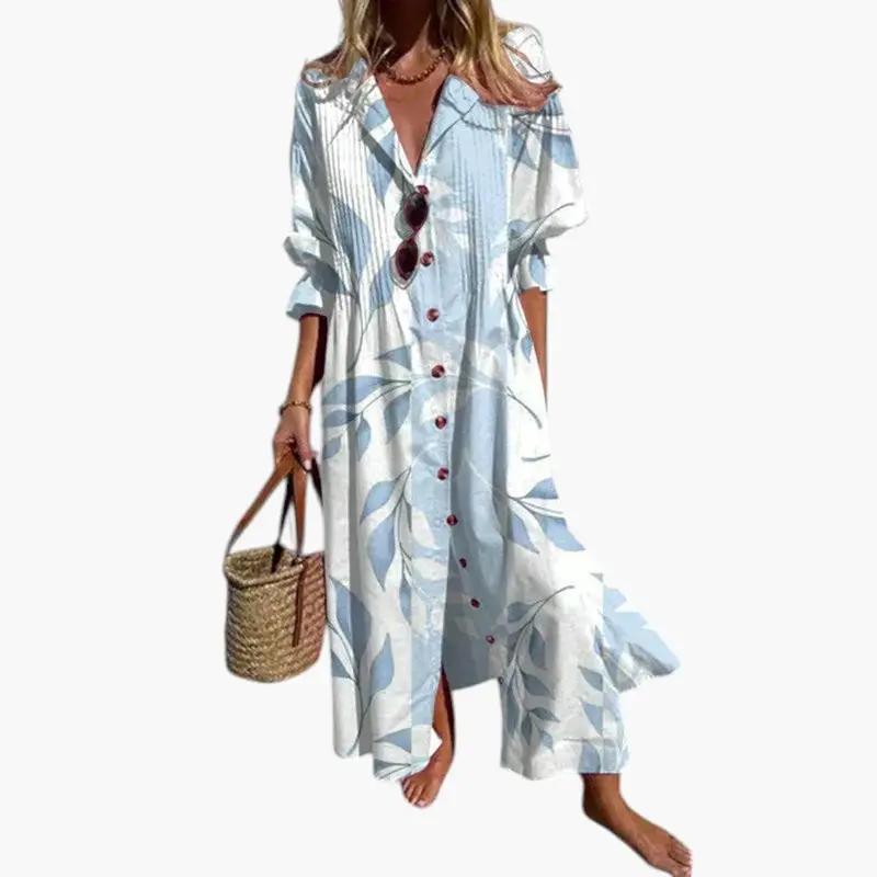 Women's floral print maxi dress with pockets in light blue and white; button-front summer dress.