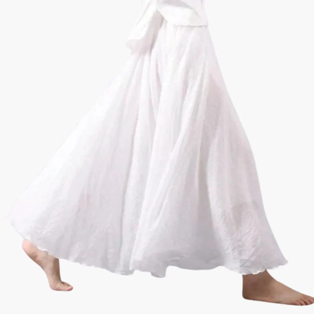 Women's maxi skirt, white, elastic waistband, flowing full-length silhouette.