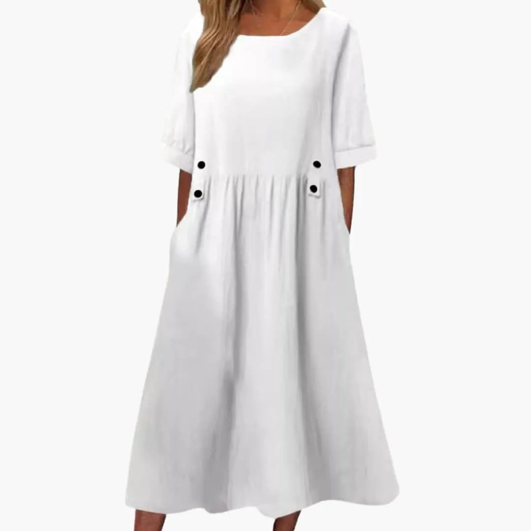 Women's Midi Dress by Wilfred Smith in white with round neck, loose fit, side pockets and black button accents