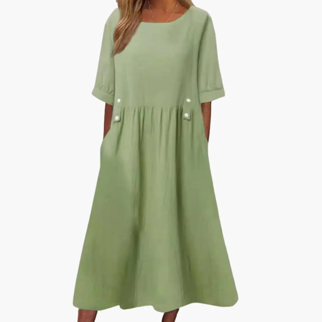 Women's midi dress by Wilfred Smith in light green with round neck and loose fit.