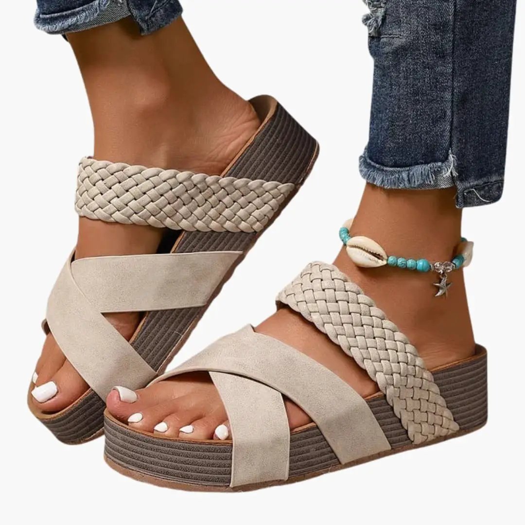 Wilfred Smith women's orthopedic sandals with contoured sole, beige braided straps, and slip-on platform.