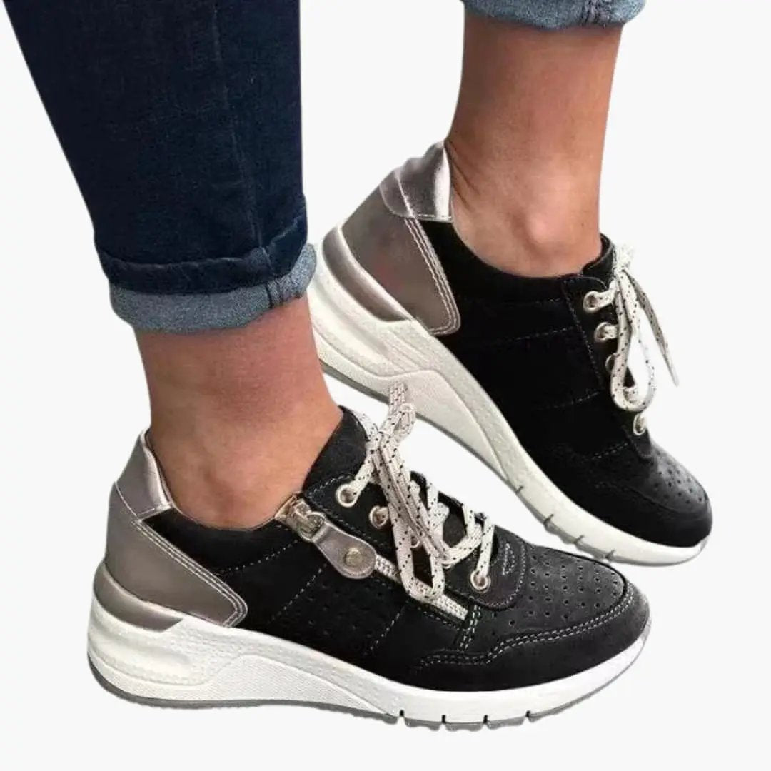 Women's orthopedic sneakers by Wilfred Smith with cushioned lining and textured sole, black and gray upper.