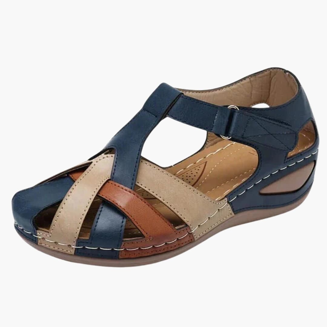 Women's orthopedic sandals with buckle straps and wedge sole in navy blue, beige and tan leather.