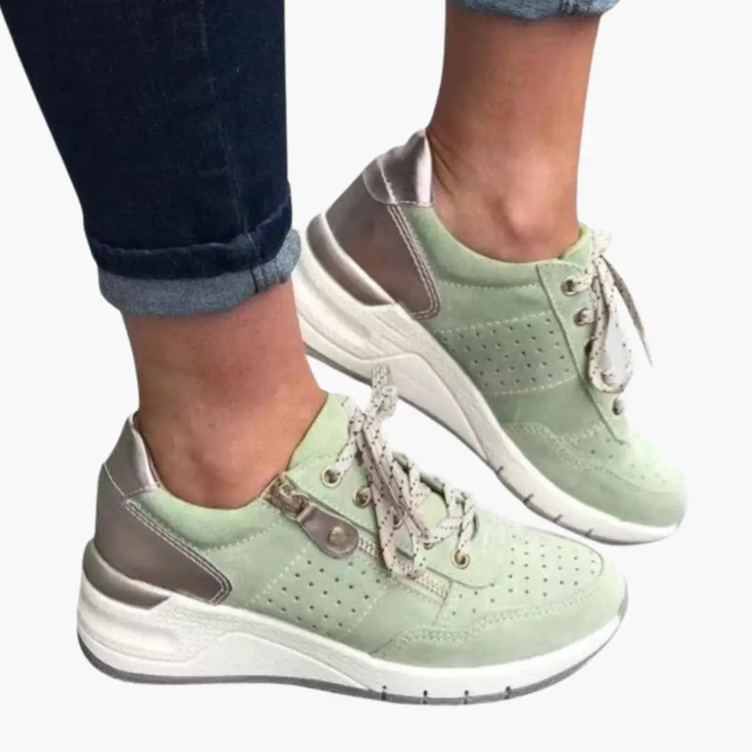 Pair of Wilfred Smith women's orthopedic sneakers with cushioned sole and lace closure in mint green