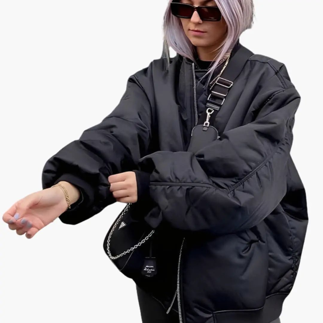 Women's oversized bomber jacket by Wilfred Smith in black with long sleeves and side pockets