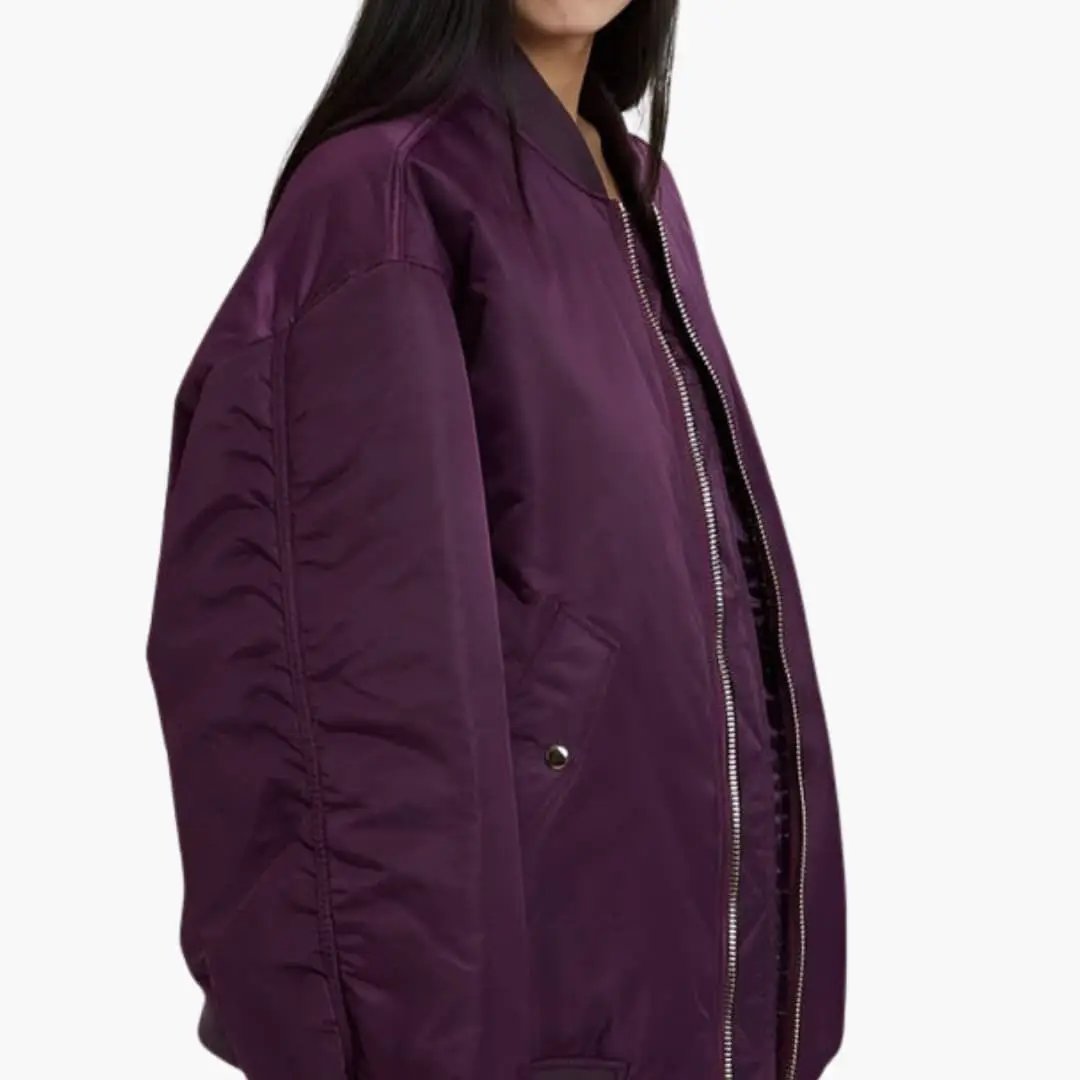 Women's oversized purple bomber jacket with zip front, long sleeves, and side pockets by Wilfred Smith