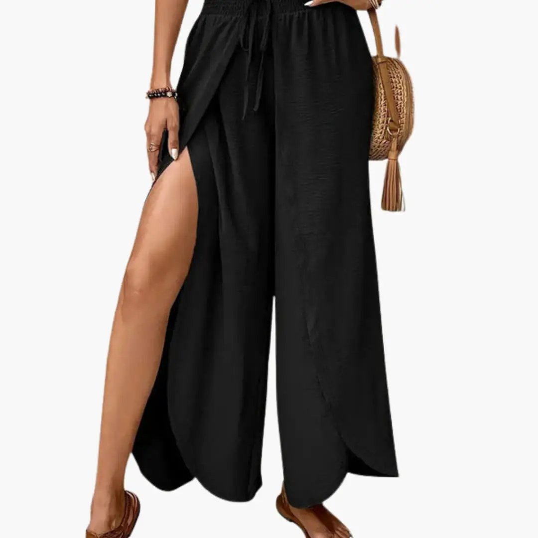 Women's Palazzo trousers in black with side slits and drawstring waist by Wilfred Smith.