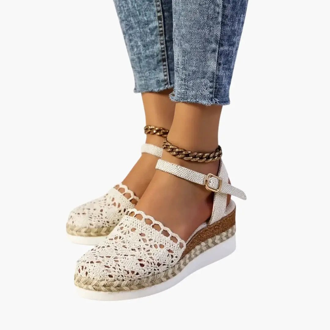 Women's platform sandals by Wilfred Smith with white woven crochet straps, ankle buckle, and cushioned espadrille sole