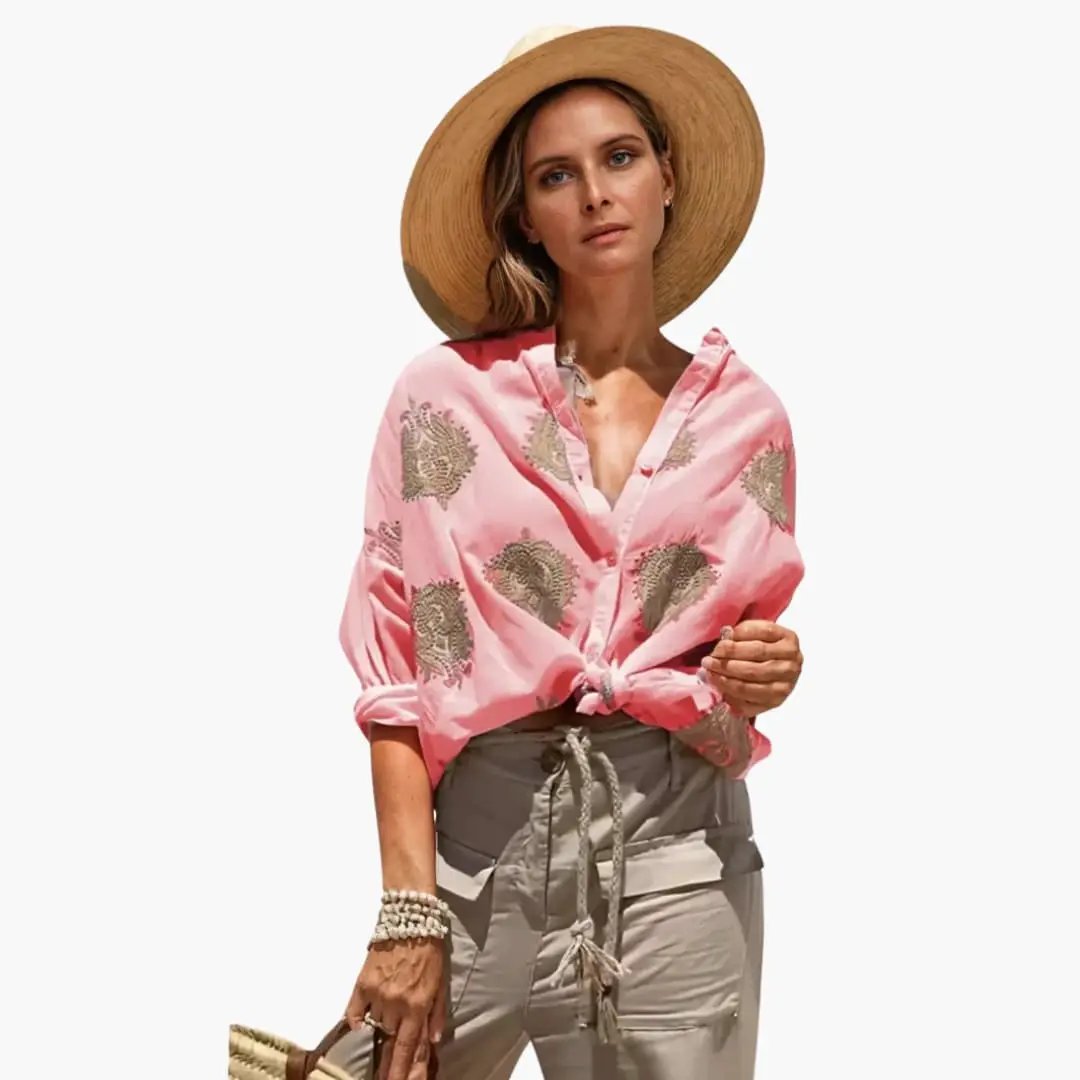 Women's pink printed blouse with relaxed fit and front knot, round neck; beige floral print by Wilfred Smith.