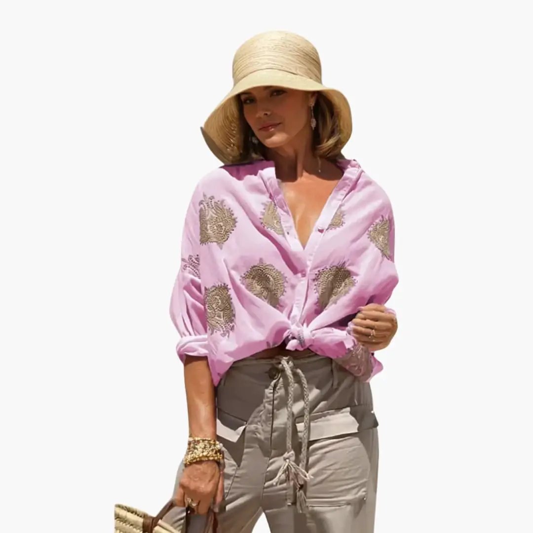 Women's pink printed blouse with gold floral pattern, relaxed fit, long sleeves.