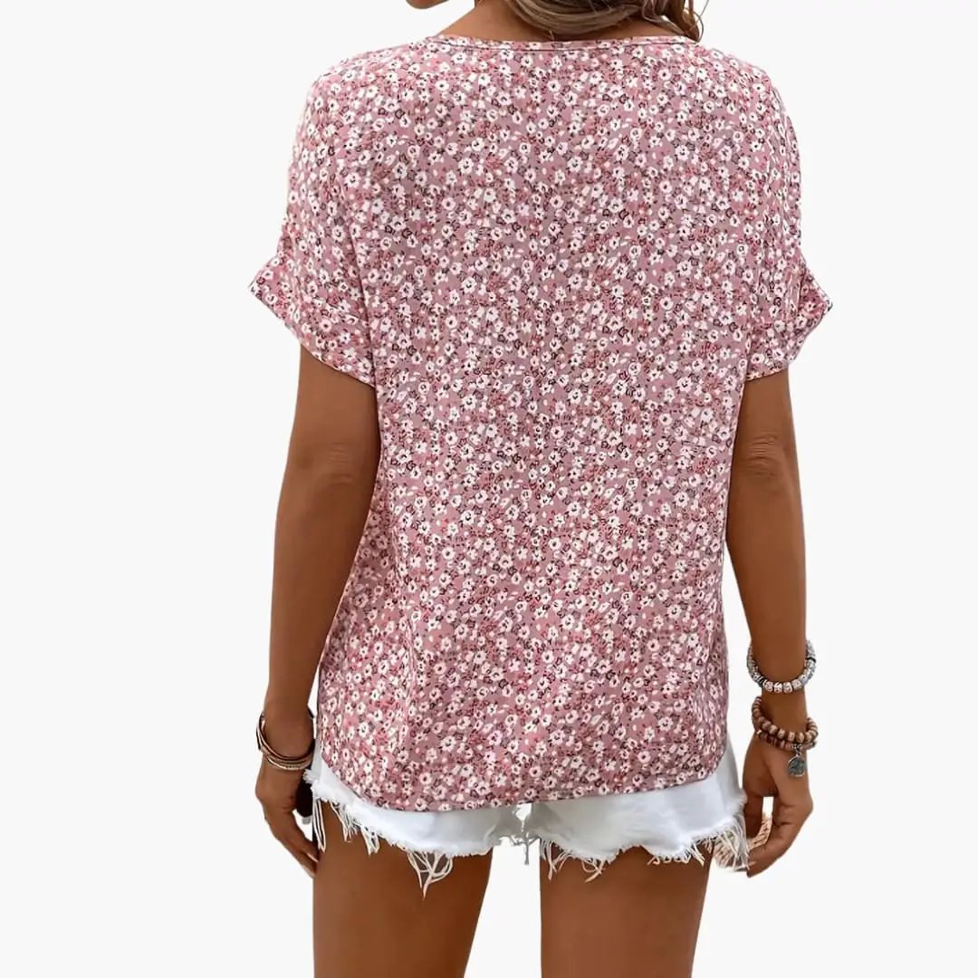 Women’s printed button-down blouse in pink floral print with a loose fit