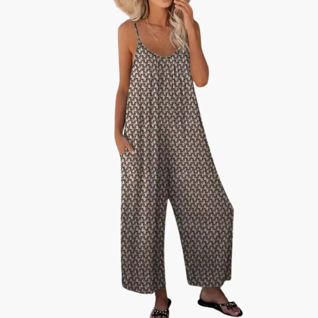 Women's printed one-piece jumpsuit with adjustable straps and pockets in tan-brown geometric print.