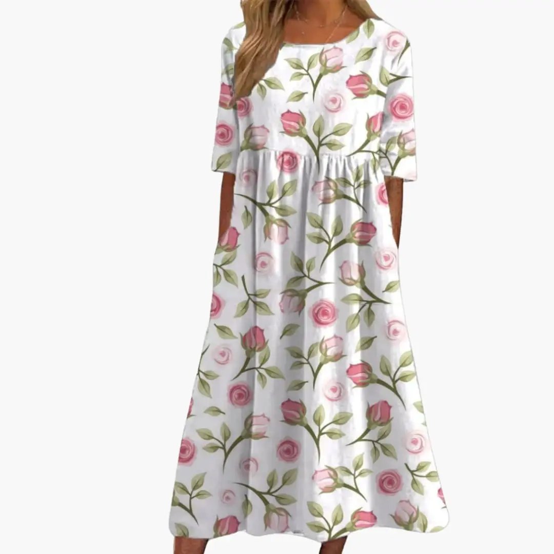 Women’s midi dress with pink rose floral print on white, short sleeves, loose-fit summer style.