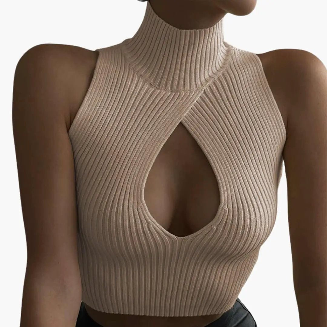 Women's ribbed sleeveless top with high collar in beige, crisscross front and keyhole neckline.