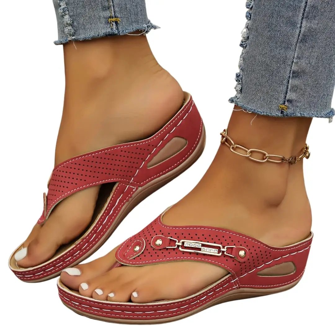 Wilfred Smith women's red perforated leather sandals with adjustable straps and cushioned sole.