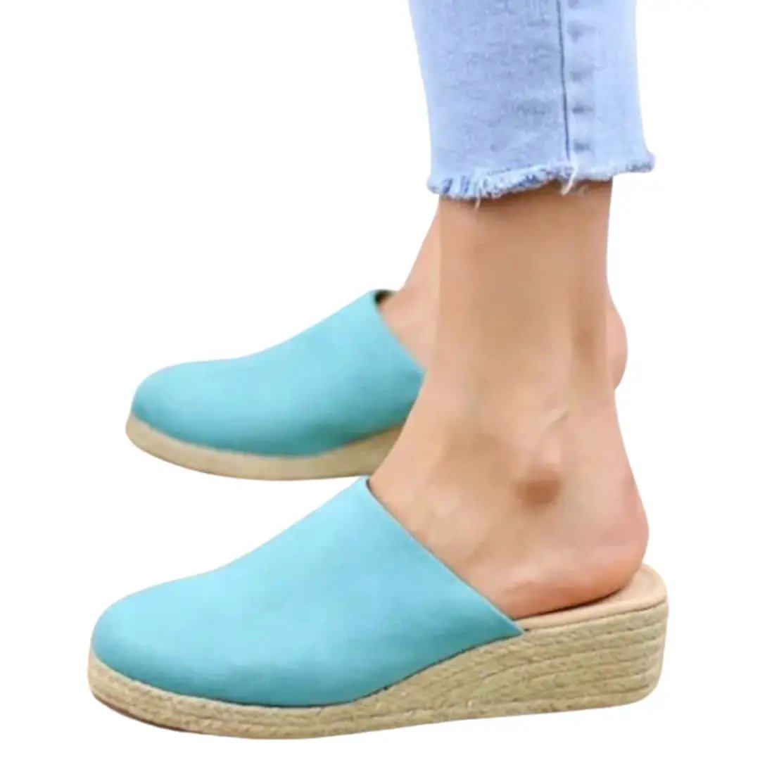 Women's sandals by Wilfred Smith in turquoise with cushioned footbed and strap fastening.